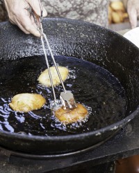 Frying donuts in the street